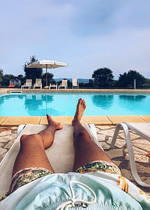 Person Lying On Pool Lounge thumbnail