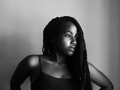 grayscale photo of woman wearing spaghetti strap top thumbnail
