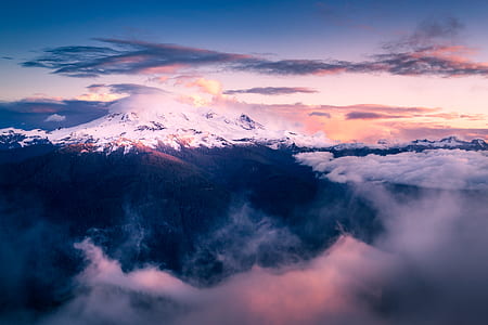 gray mountain under cloudy sky thumbnail