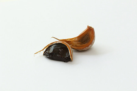 brown garlic on white surface thumbnail