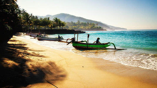green canoe on blue ocean water during daytime thumbnail