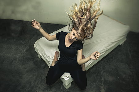 woman in black V-neck shirt and pants thumbnail
