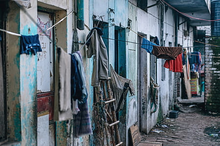 clothes hanged on clothesline near houses thumbnail