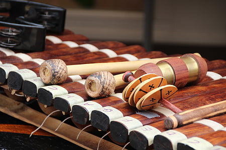 brown and white musical instrument thumbnail