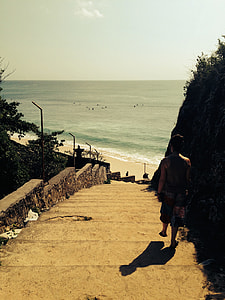woman down on concrete stairs during day time thumbnail
