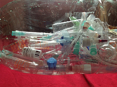 pile of clear bottles on red surface thumbnail