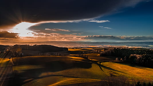 high angle view of green field during golden hour thumbnail