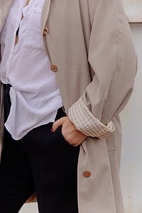 person wearing long coat thumbnail