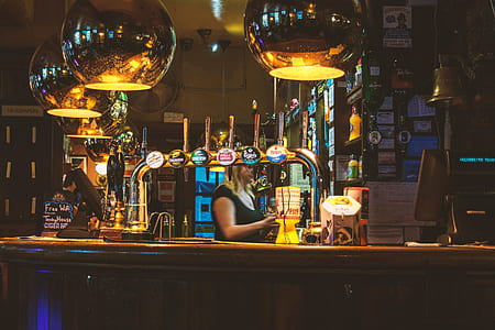 woman in front of bar desk thumbnail