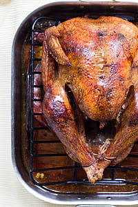 roasted chicken on rectangular black and gray grill thumbnail
