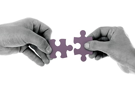 two person holding purple puzzles thumbnail