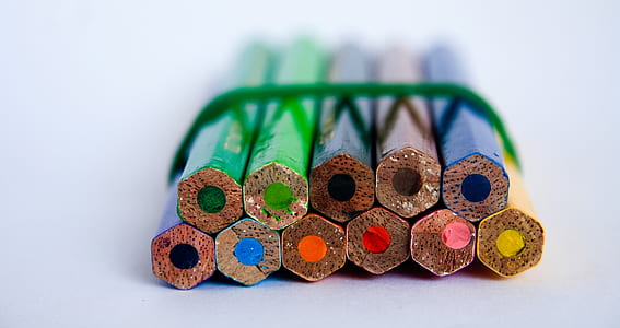 selective focus photography of colored pencils against white background thumbnail