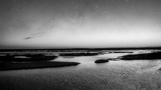 gray scale photography of body of water thumbnail