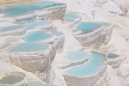 rock formation with body of water photo thumbnail