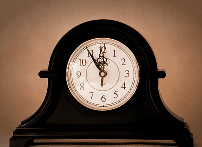 black mantel clock at 11:55 thumbnail