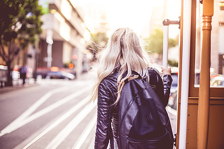 Young Woman Enjoying Ride on an Iconic Cable Car in San Francisco thumbnail