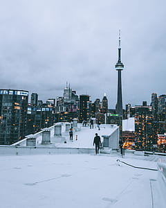 people standing on building roof thumbnail