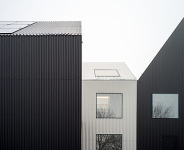 architecture photography of white and black buildings thumbnail