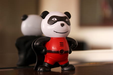 red and black panda figure next to mirror thumbnail