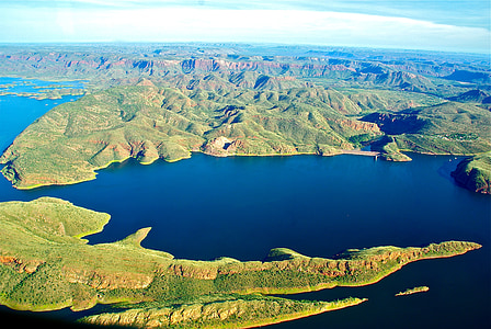 aerial photography of body of water across mountains thumbnail
