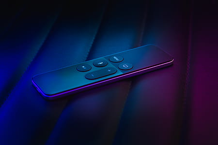 black remote controller on purple textile thumbnail