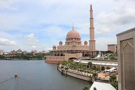 beige mosque beside body water thumbnail