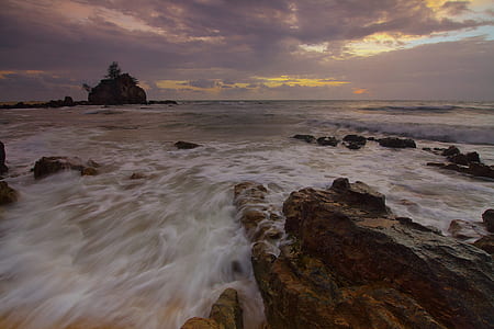 Flowing Water to the Ocean Under Grey Sky thumbnail