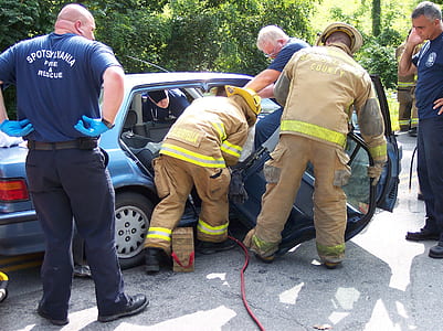 people dismantling blue Honda sedan during daytime thumbnail
