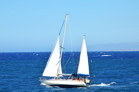 white sailboat on body of water during daytime thumbnail