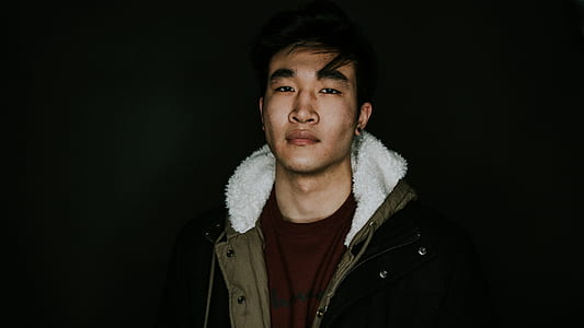 man wearing brown and black parka coat thumbnail