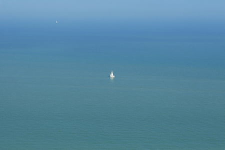 white sailboat in middle of sea thumbnail
