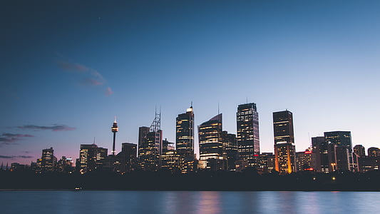 photo of cityscape near body of water thumbnail