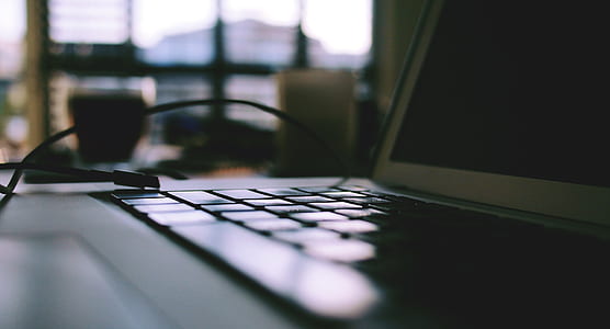 selective focus photography of laptop computer thumbnail