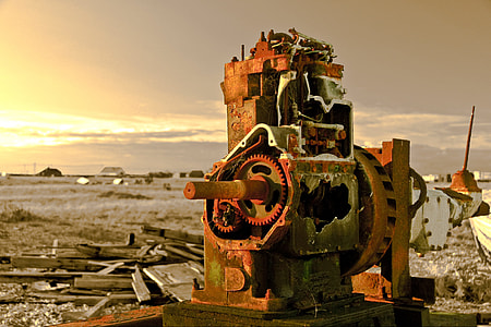 Landscape shot containing an old abandoned piece of machinery captured at sunset on the coast at Dungeness, Kent, England thumbnail
