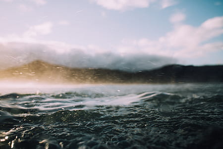 selective focus photo of body of water with waves thumbnail