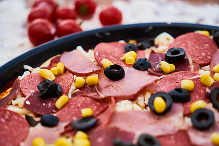 pizza on black pan thumbnail