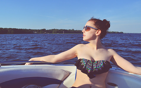 woman sitting on speedboat thumbnail