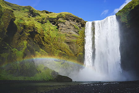 waterfalls rushing in to the water with rainbow screengrab thumbnail