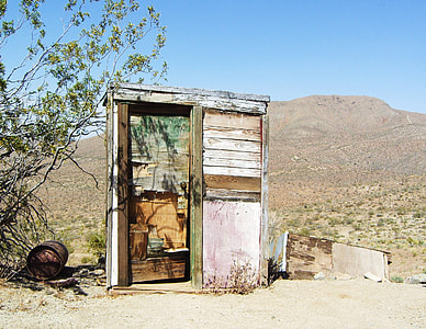 brown wooden shed under blue sky thumbnail