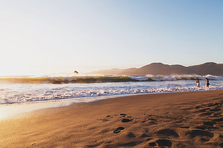 two person standing on seashore thumbnail
