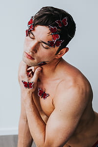red 3D butterflies on man's body thumbnail