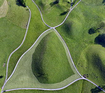 high angle photo of green lawn grasses and roads during daytime thumbnail