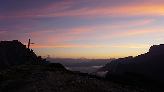 black cross on top of mountain thumbnail