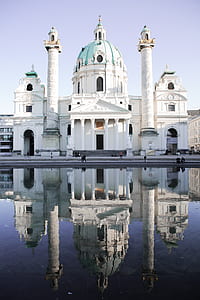 people walking in front of white structure thumbnail