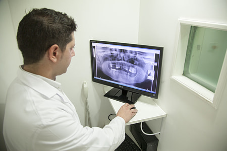 person looking at monitor and using mouse thumbnail