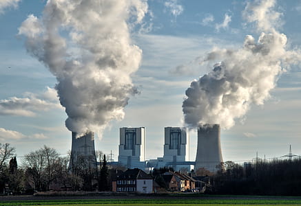 white powerplant producing smokes at daytime thumbnail