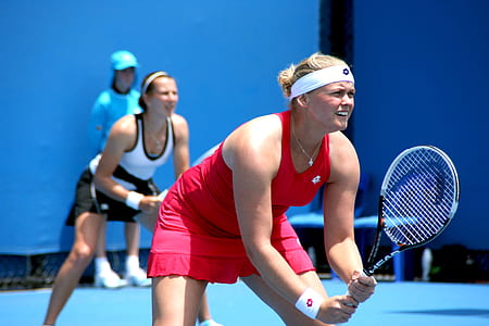 woman holding tennis racket thumbnail