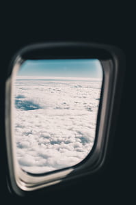 clear glass plane mirror showing white clouds thumbnail