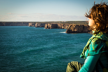 woman staring at sea thumbnail