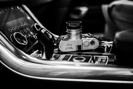 silver and black SLR camera in grayscale photography thumbnail